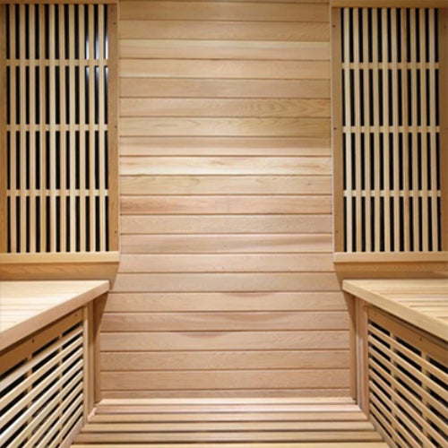 inside view of wooden Roslyn 4-person infrared sauna in cedar showing two benches