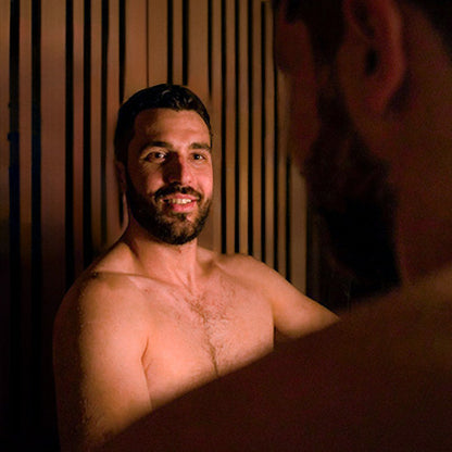 two men in the Roslyn 4-person infrared sauna in cedar